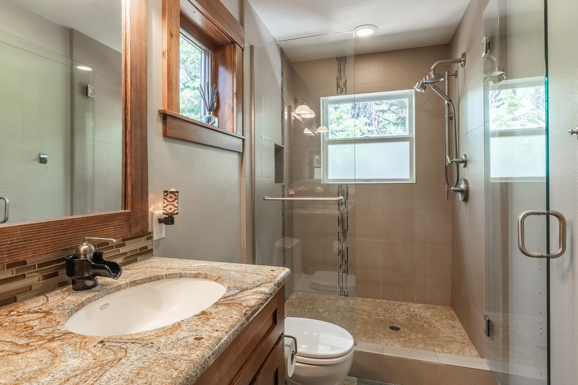 62 Cliff Circle Mammoth Lakes, CA 93546 - Photo 25 of 45 a bathroom with a granite countertop sink toilet and shower
