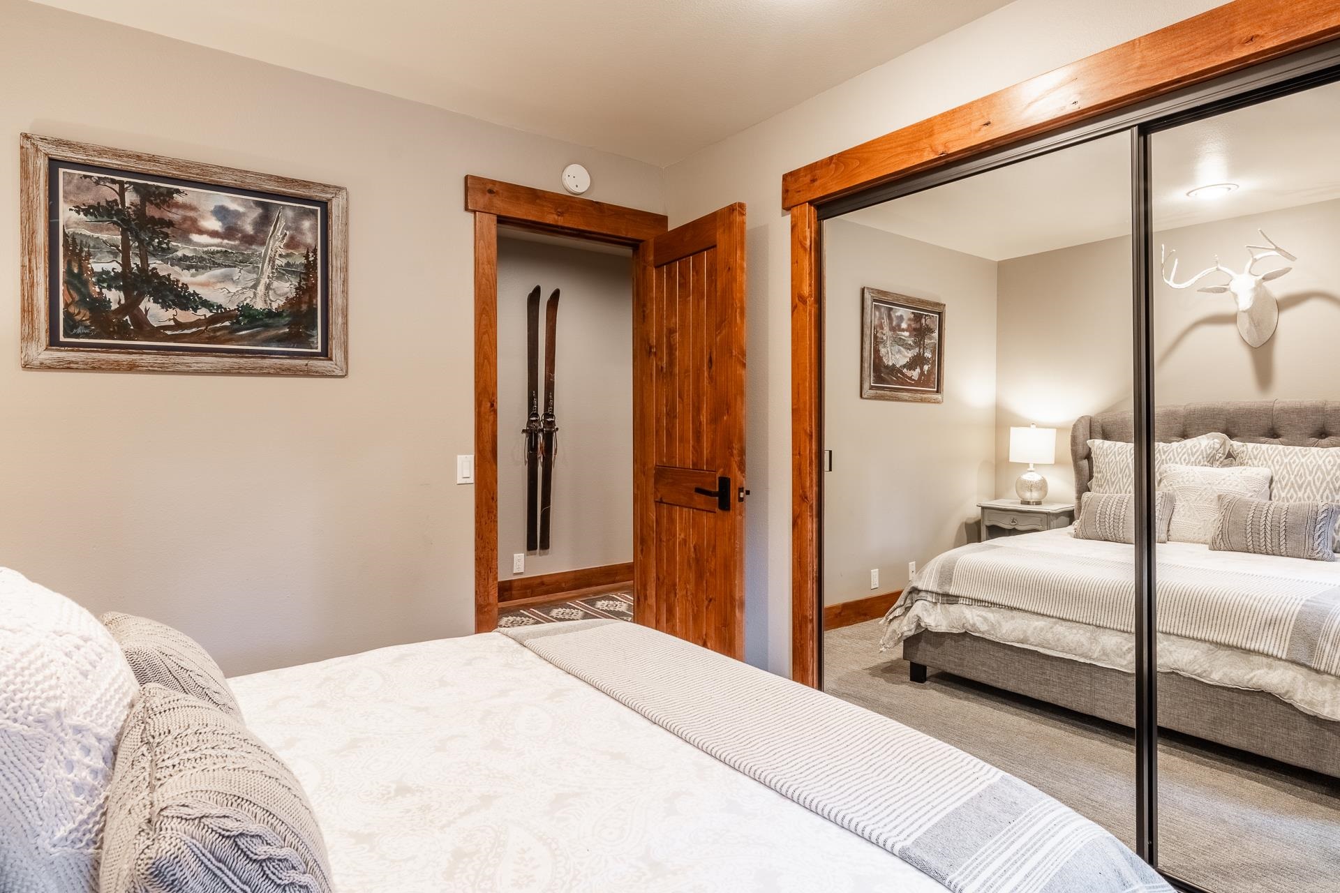 62 Cliff Circle Mammoth Lakes, CA 93546 - Photo 30 of 45 a bedroom with a bed and a painting on the wall