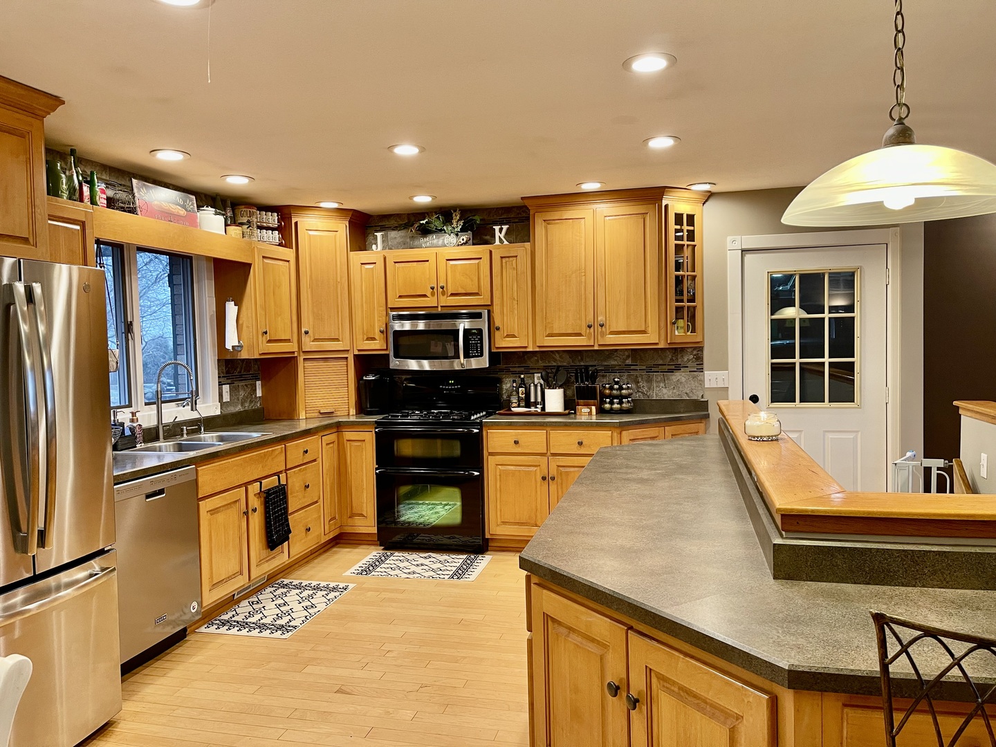 811 North 38th Road Mendota, IL 61342 - Photo 5 of 27 a large kitchen with stainless steel appliances kitchen island granite countertop a sink and cabinets