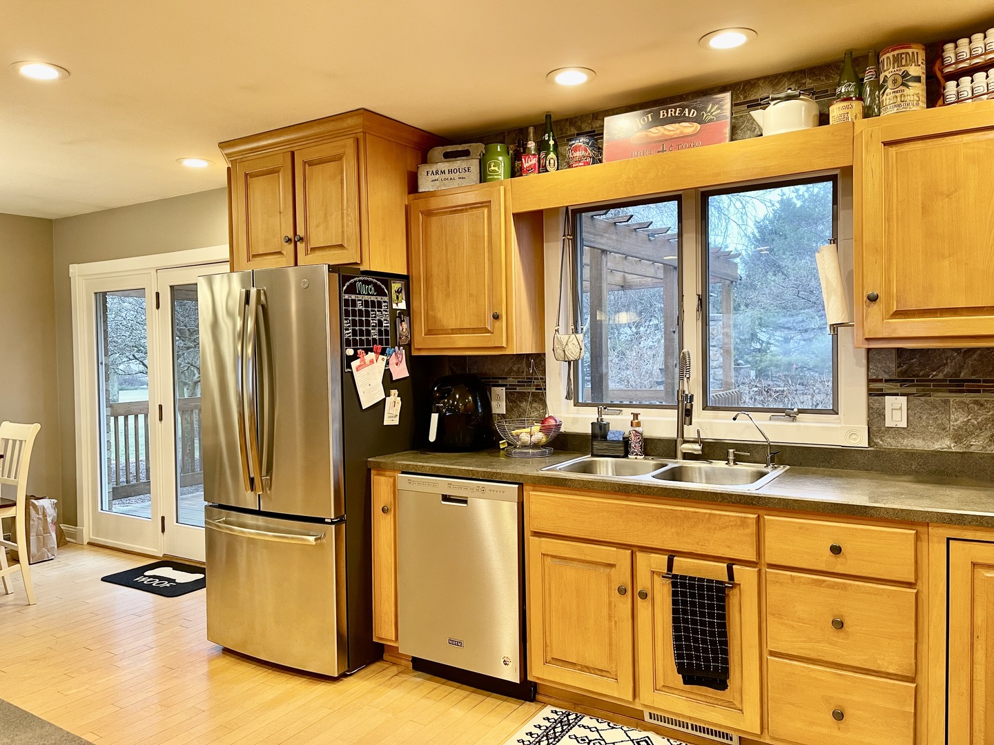 811 North 38th Road Mendota, IL 61342 - Photo 7 of 27 a kitchen with stainless steel appliances granite countertop a refrigerator a sink and white cabinets