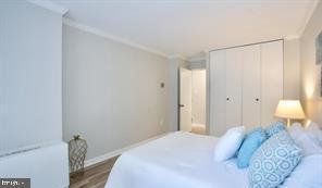 1280 21st Street Northwest, Unit 109 Washington, DC 20036 - Photo 11 of 22 a bedroom with a bed and a window