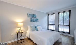1280 21st Street Northwest, Unit 109 Washington, DC 20036 - Photo 13 of 22 a bedroom with a bed and a window