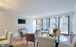 1280 21st Street Northwest, Unit 109 Washington, DC 20036 - Photo 18 of 22 a dining room with furniture and wooden floor
