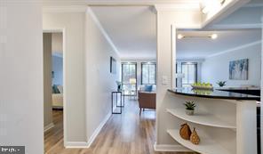 1280 21st Street Northwest, Unit 109 Washington, DC 20036 - Photo 2 of 22 a view of living room with furniture and wooden floor
