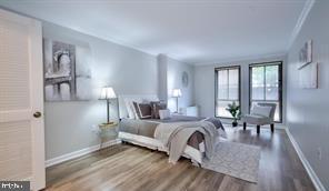 1280 21st Street Northwest, Unit 109 Washington, DC 20036 - Photo 10 of 22 a living room with furniture and a table