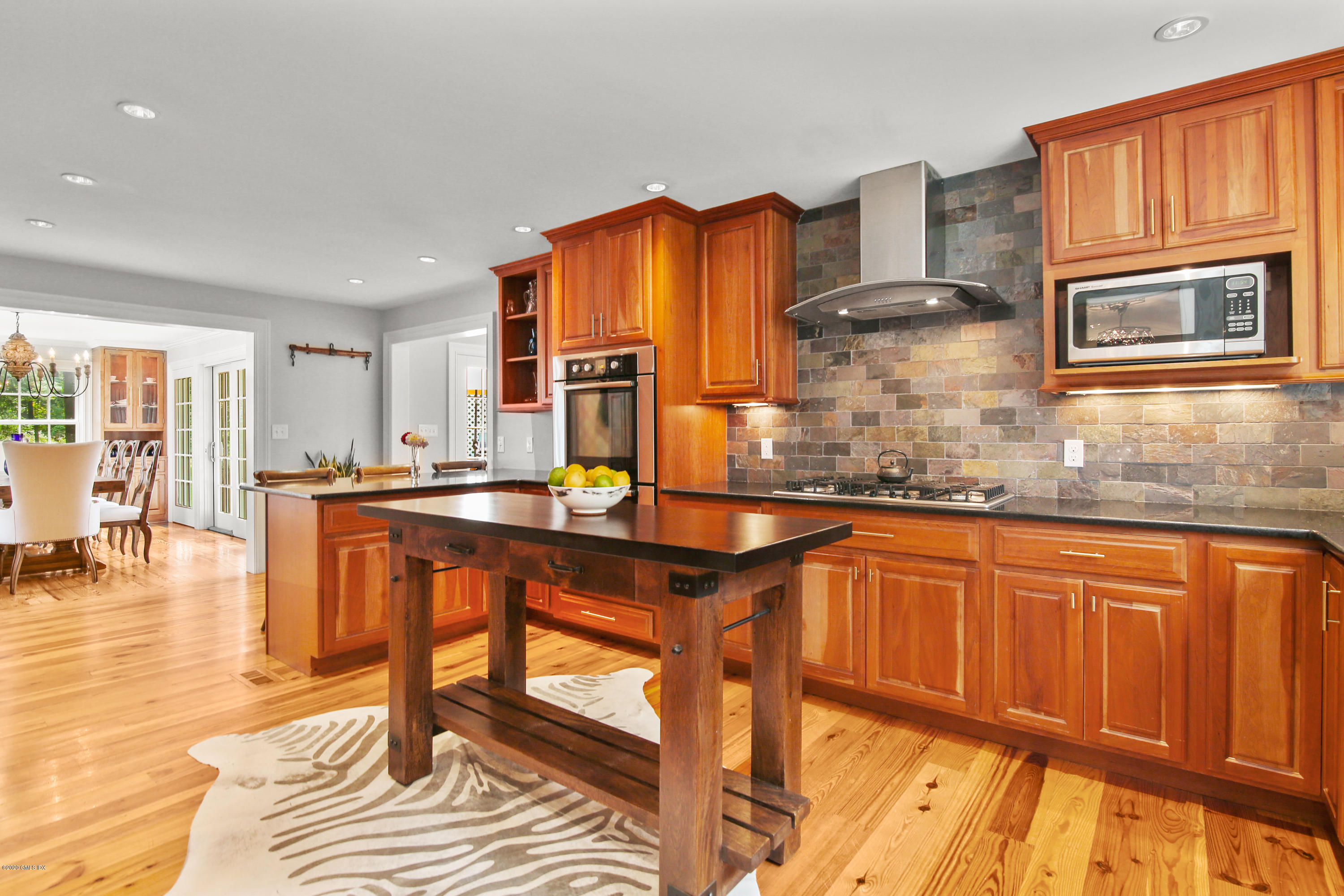 20 Scott Road Greenwich, CT 06831 - Photo 11 of 42 a dining hall with stainless steel appliances granite countertop a stove and a sink