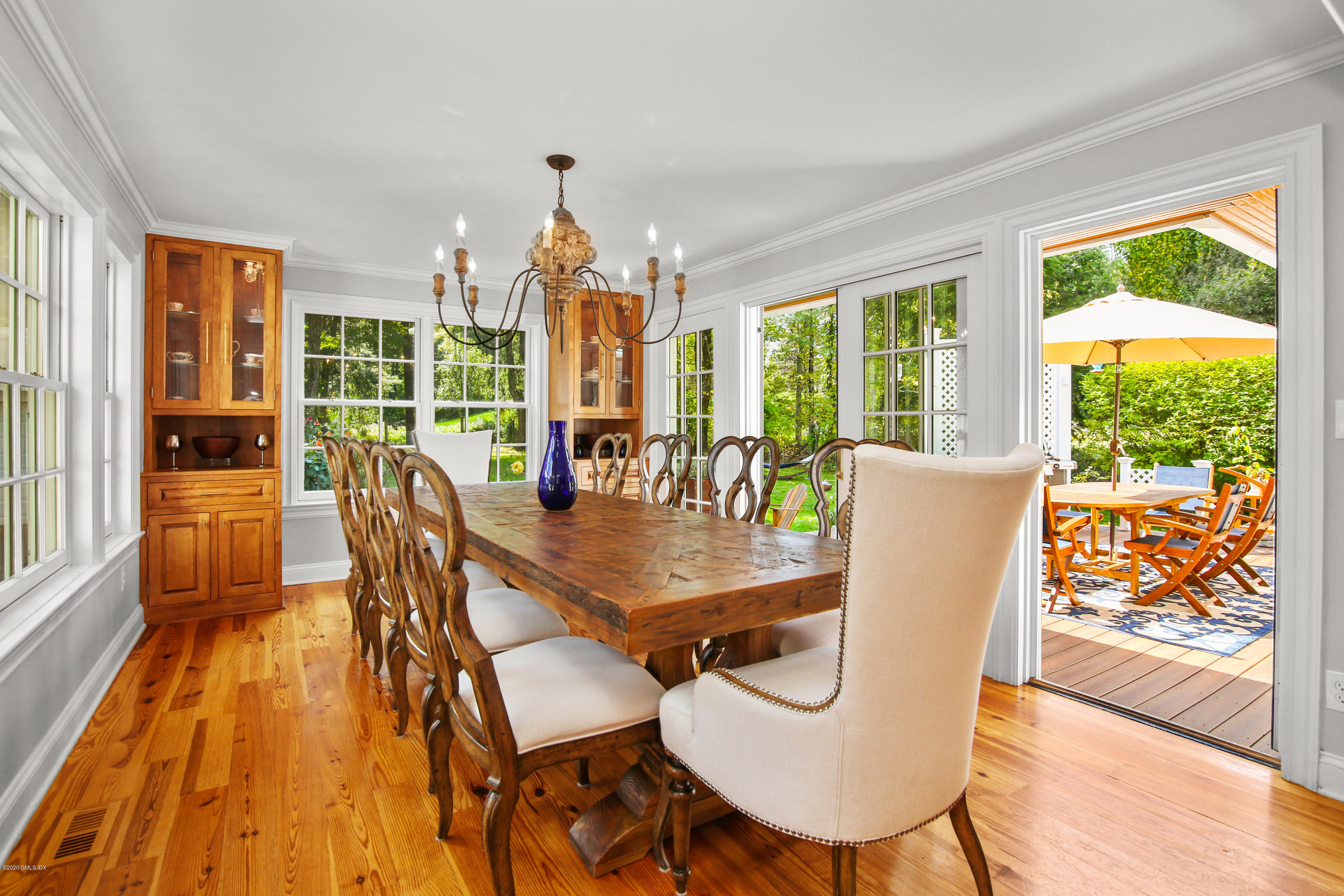 20 Scott Road Greenwich, CT 06831 - Photo 13 of 42 a dining room with furniture a chandelier and wooden floor