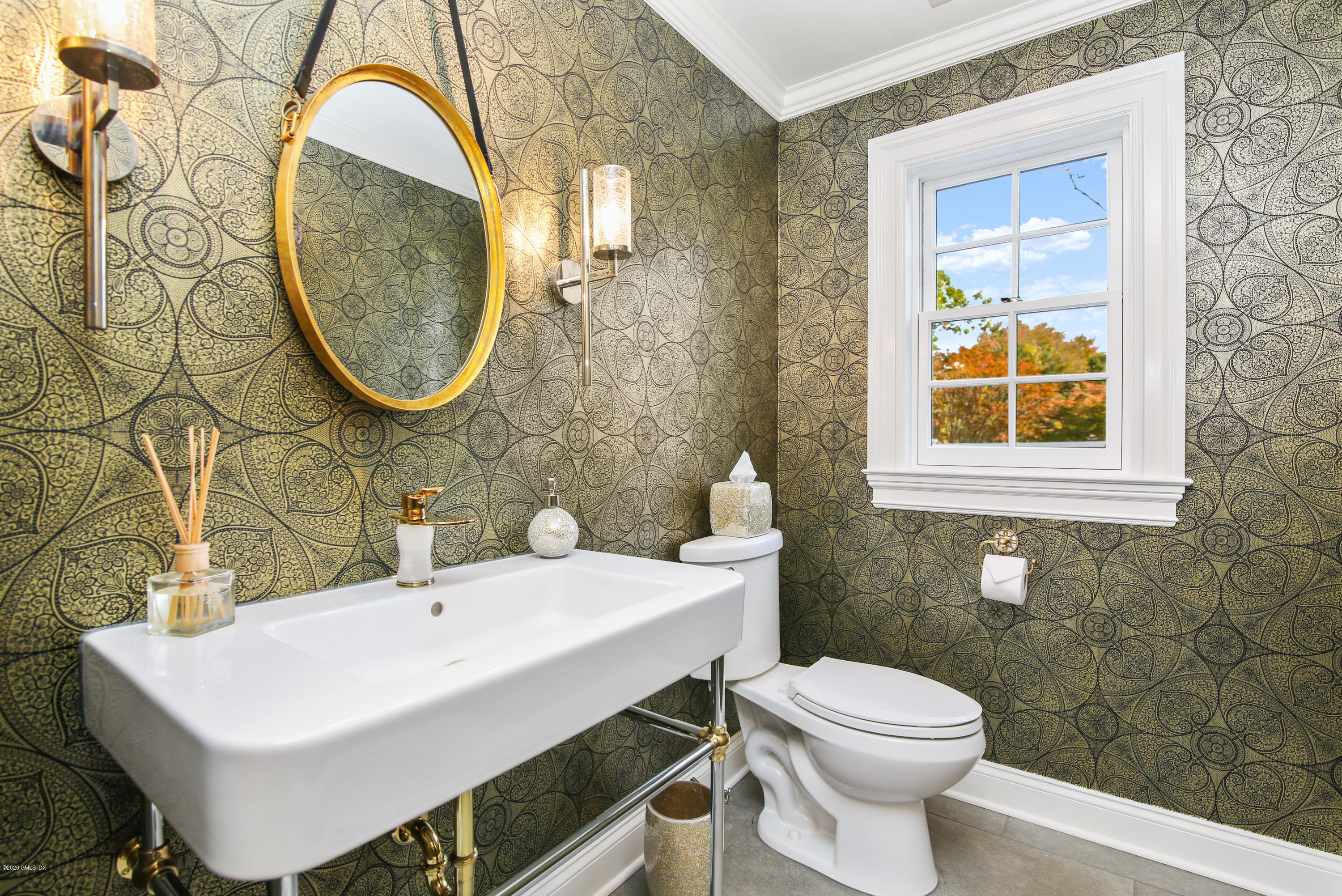 20 Scott Road Greenwich, CT 06831 - Photo 18 of 42 a bathroom with a sink a toilet and a mirror