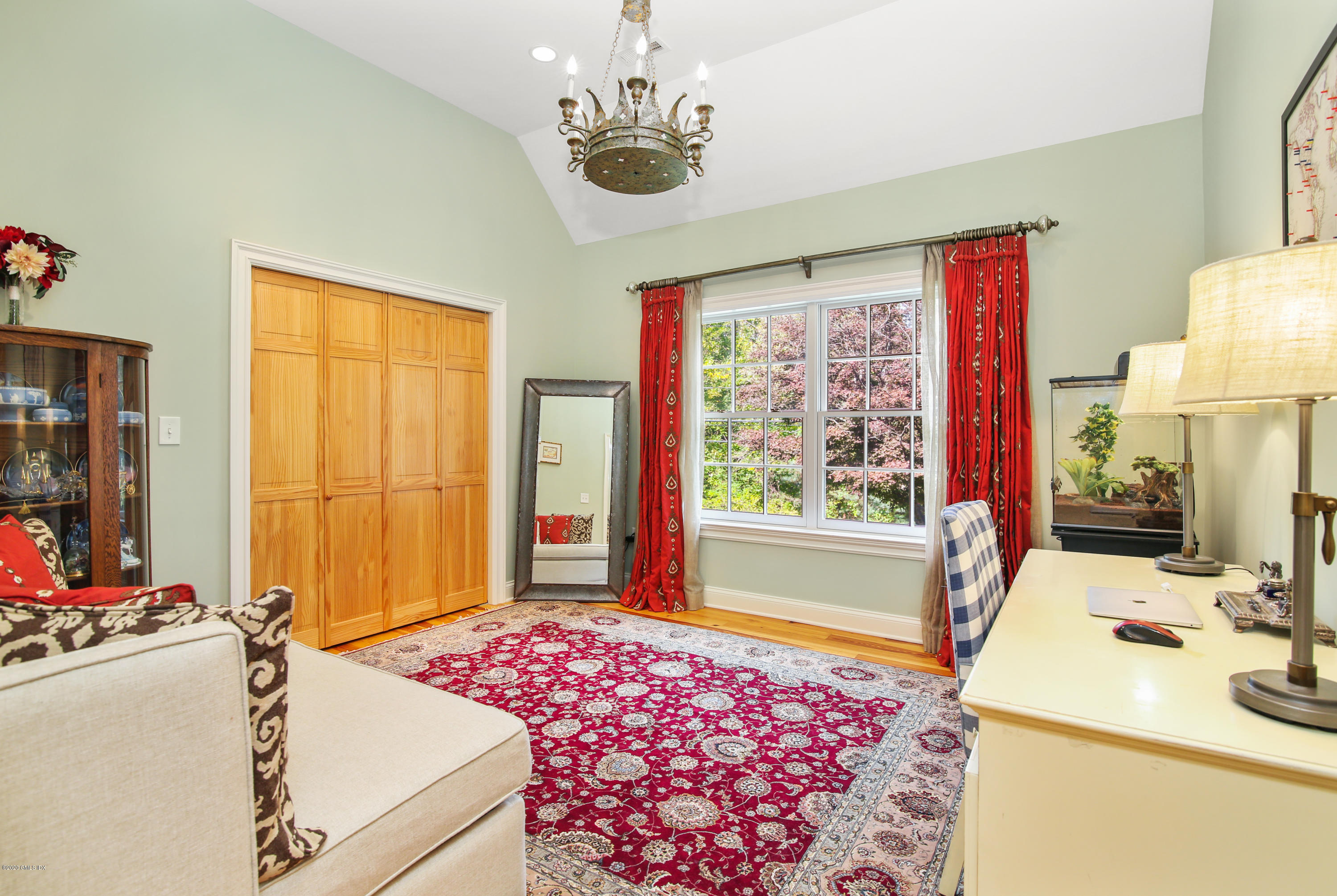 20 Scott Road Greenwich, CT 06831 - Photo 23 of 42 a bedroom with a bed and a window