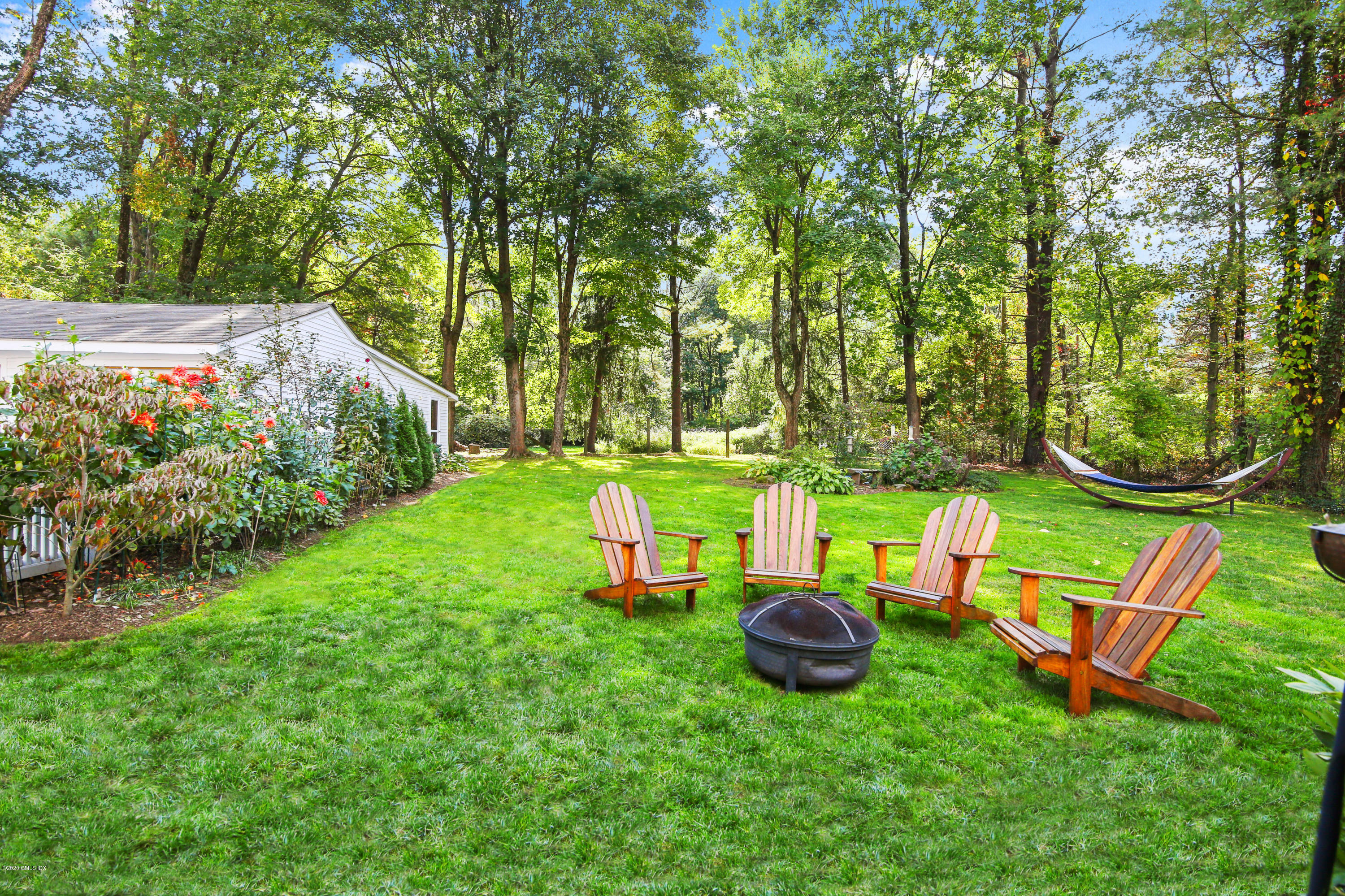 20 Scott Road Greenwich, CT 06831 - Photo 32 of 42 an aerial view of a house with backyard outdoor seating and green space