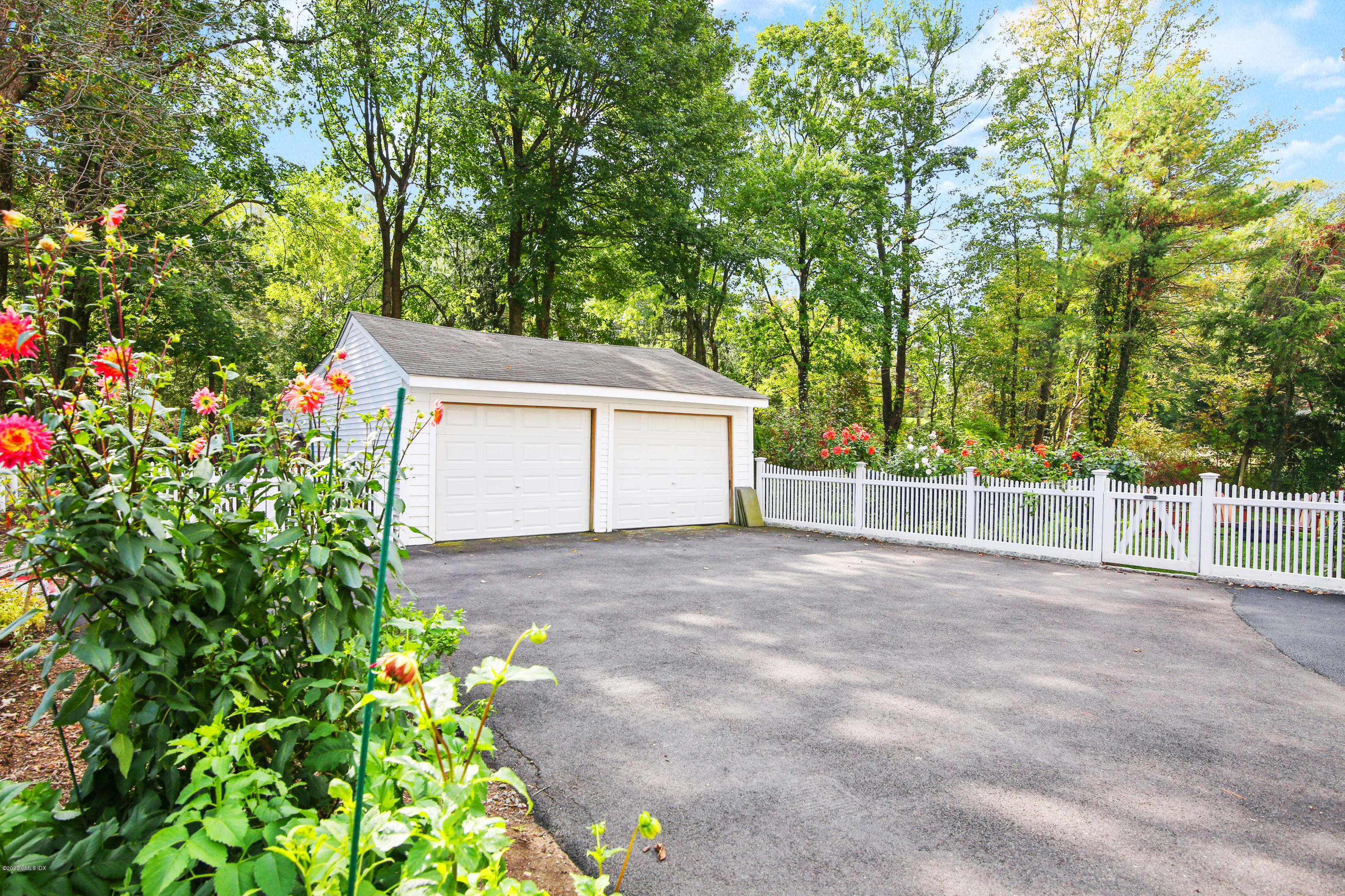 20 Scott Road Greenwich, CT 06831 - Photo 38 of 42 a view of a house with a garage and garden