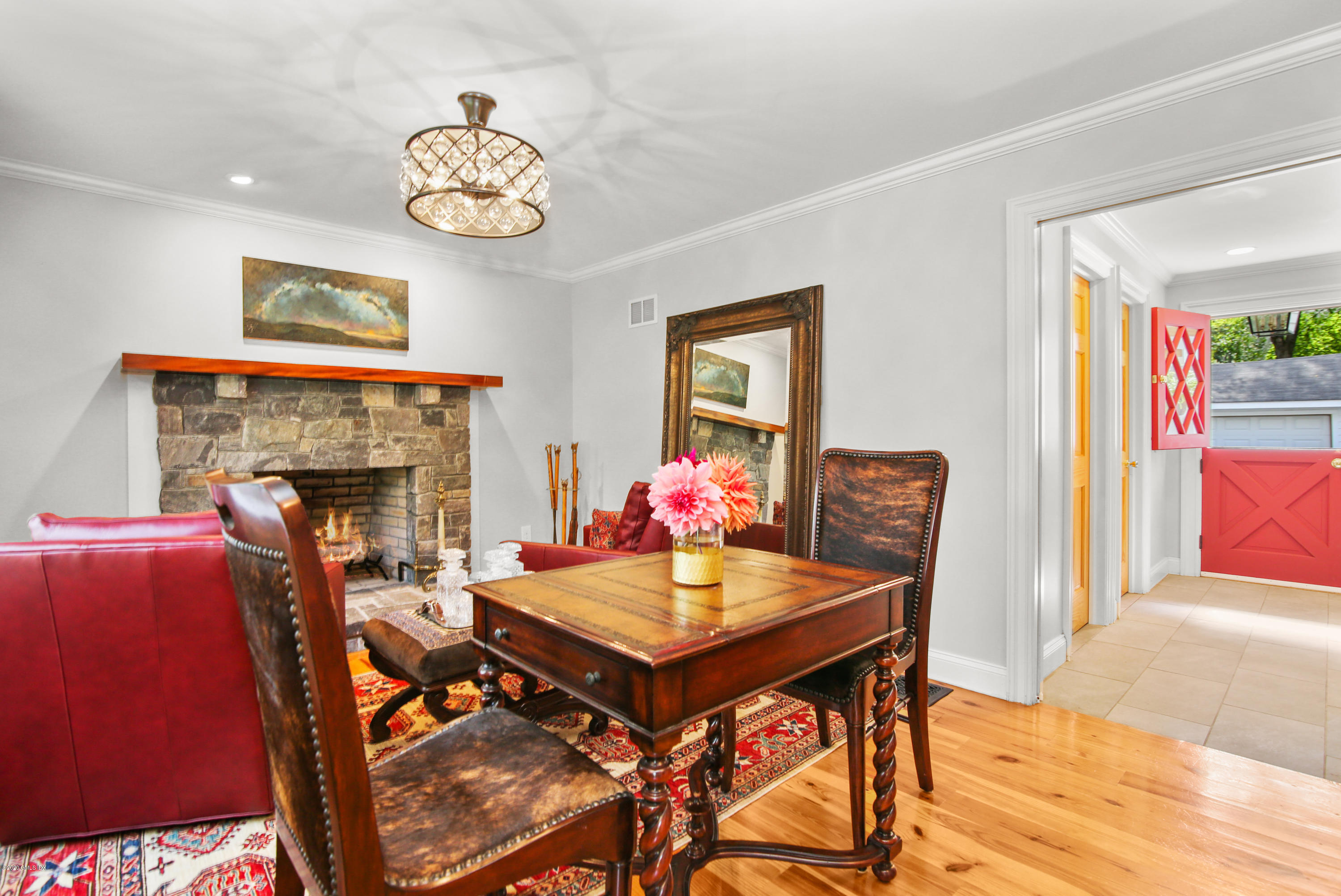 20 Scott Road Greenwich, CT 06831 - Photo 7 of 42 a view of a dining room with furniture a chandelier and wooden floor
