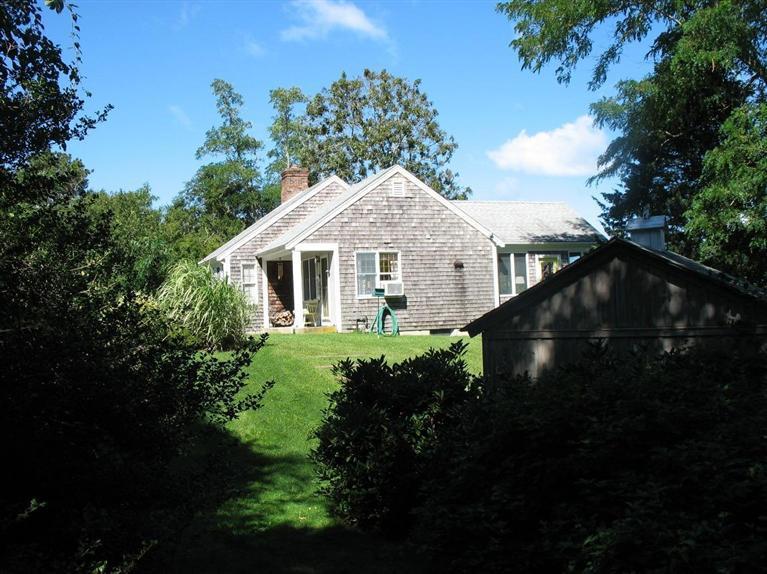 191 Rock Harbor Road Orleans, MA 02653 - Photo 3 of 19 a front view of a house with a yard