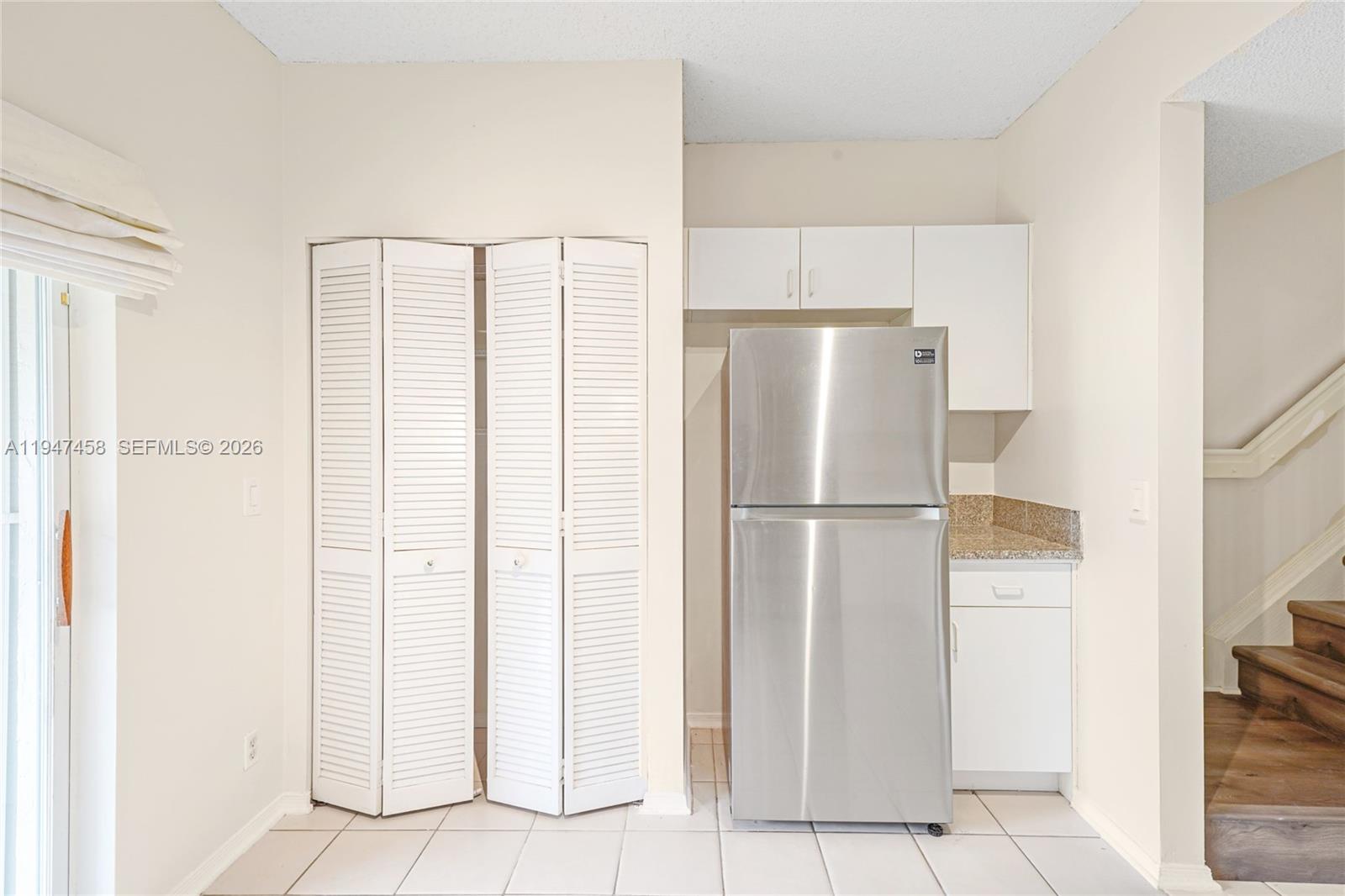 4 Key W Court, Unit 4 Weston, FL 33326 - Photo 14 of 29 a white refrigerator freezer and a dishwasher in a kitchen