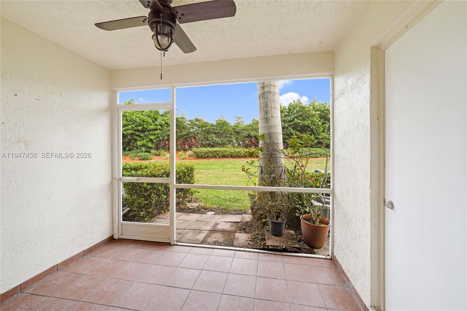 4 Key W Court, Unit 4 Weston, FL 33326 - Photo 15 of 29 a view of a room with window a ceiling fan and front door