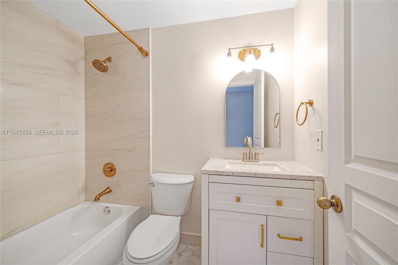 4 Key W Court, Unit 4 Weston, FL 33326 - Photo 22 of 29 a bathroom with a sink a toilet and shower
