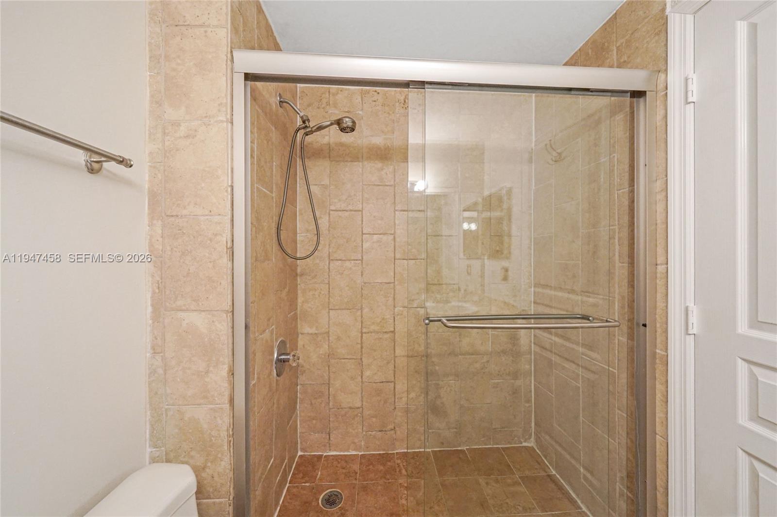 4 Key W Court, Unit 4 Weston, FL 33326 - Photo 24 of 29 a bathroom with a glass shower door