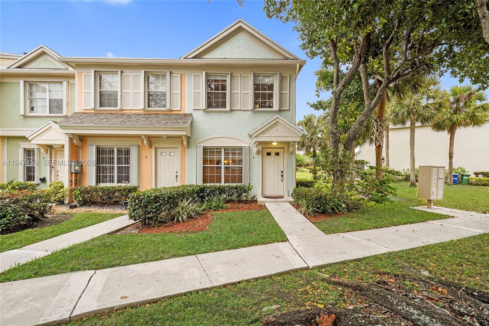 4 Key W Court, Unit 4 Weston, FL 33326 - Photo 27 of 29 a front view of a house with a yard