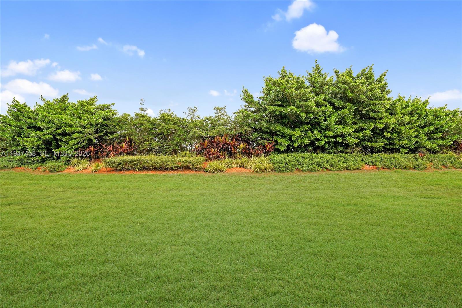 4 Key W Court, Unit 4 Weston, FL 33326 - Photo 29 of 29 a view of a green yard