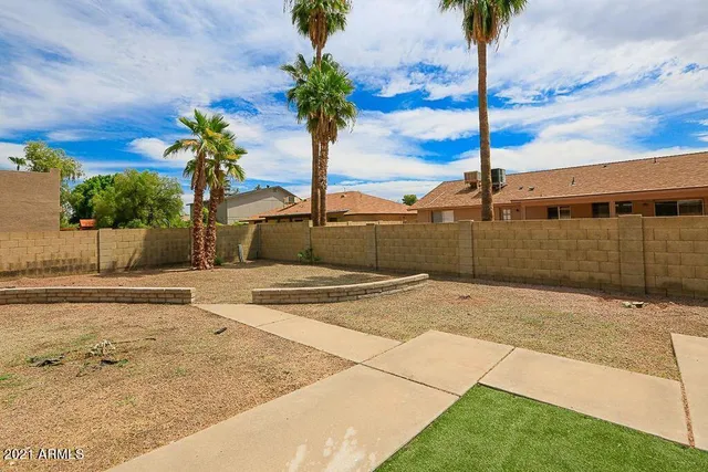 a view of a backyard of the house