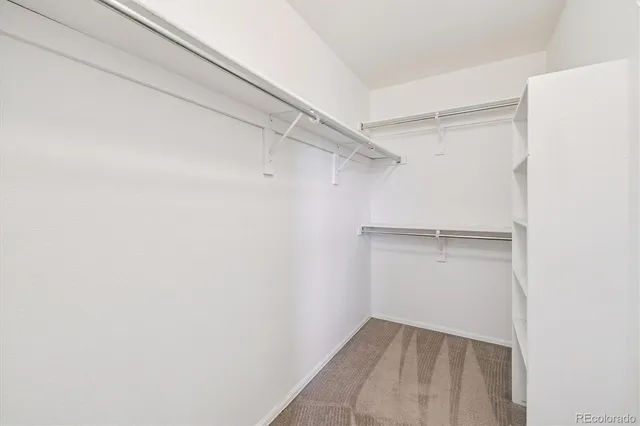 a view of an empty walk in closet