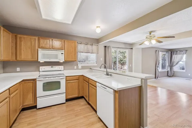 a kitchen with stainless steel appliances granite countertop a stove and a sink