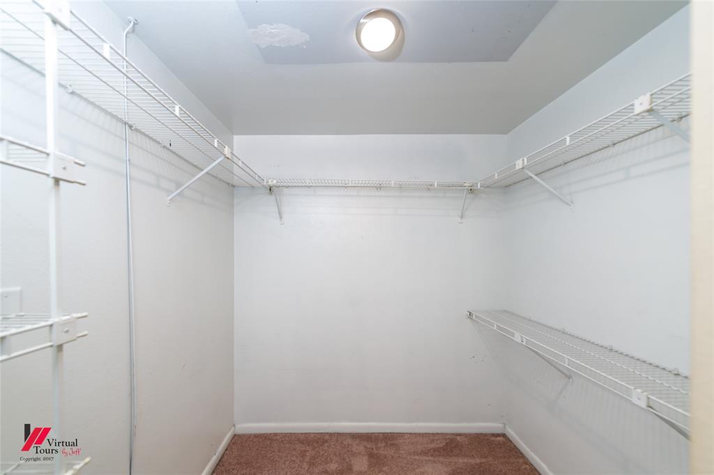 300 Pierremont Road, Unit 40 Shreveport, LA 71106 - Photo 32 of 34 Walk-in closet located featuring wire shelving and hanging rods, recessed ceiling light