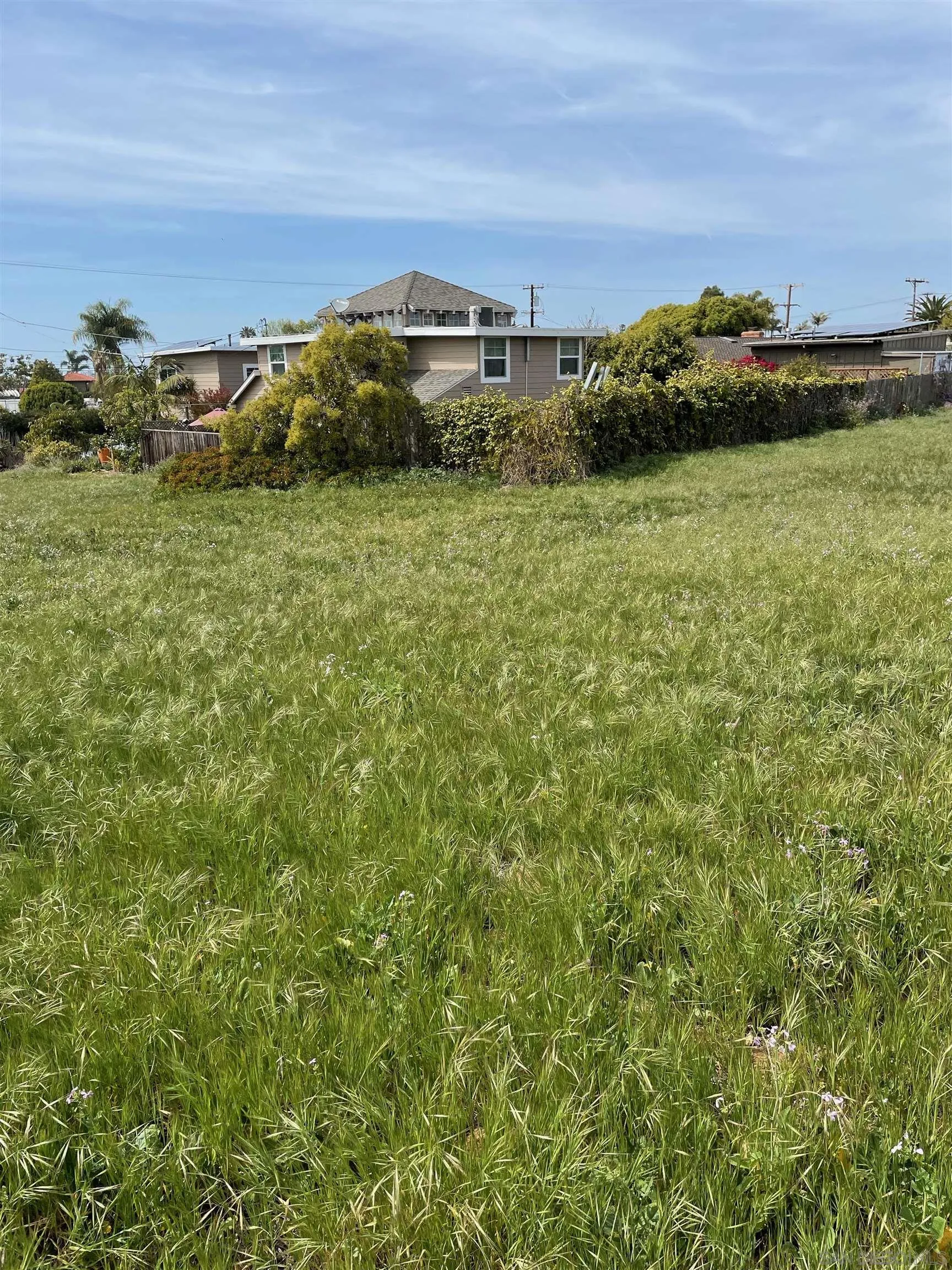 461 Ocean View Avenue, Unit 2 Encinitas, CA 92024 - Photo 12 of 25 a view of a large building with a yard