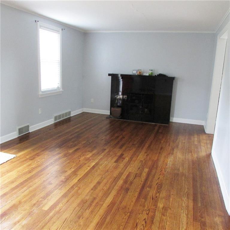 501 Nichols Road Pittsburgh, PA 15237 - Photo 13 of 24 Large living room, gas fireplace, gleaming hardwood floor