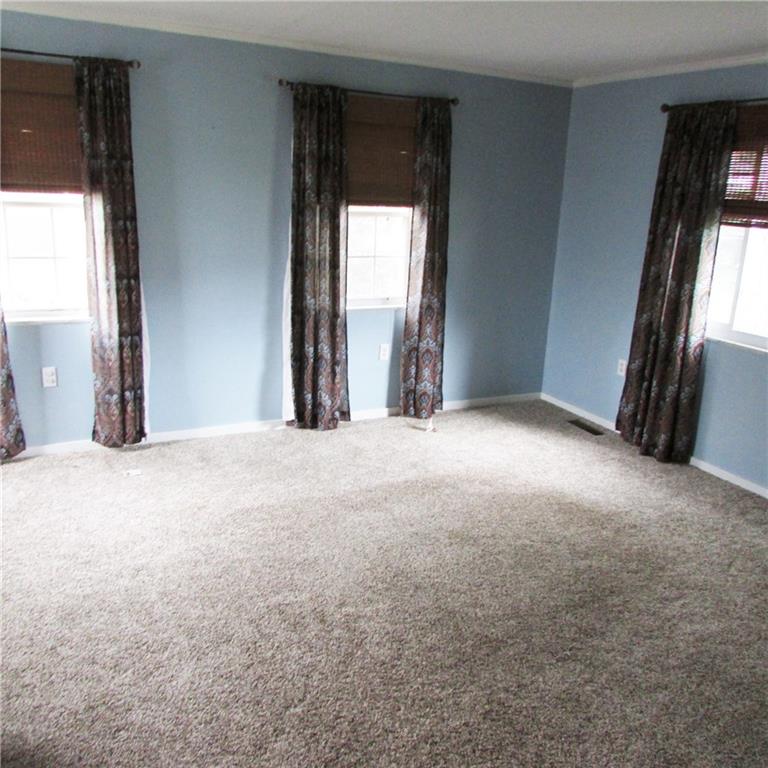 501 Nichols Road Pittsburgh, PA 15237 - Photo 10 of 24 Family room with new carpeting, large, bright windows, half bath, walk out to deck