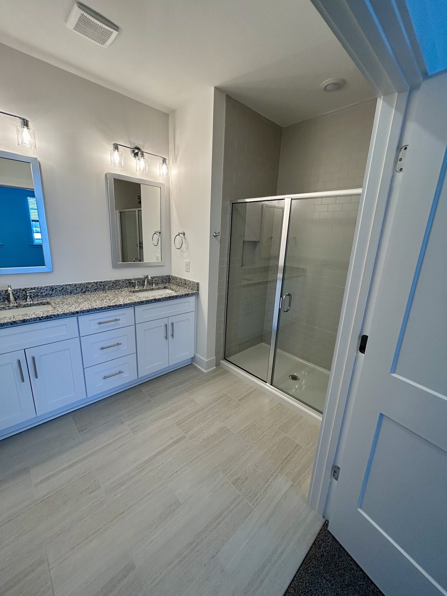 326 B Mulberry Terrace Madison, TN 37115 - Photo 11 of 21 a bathroom with a granite countertop sink a mirror and a shower