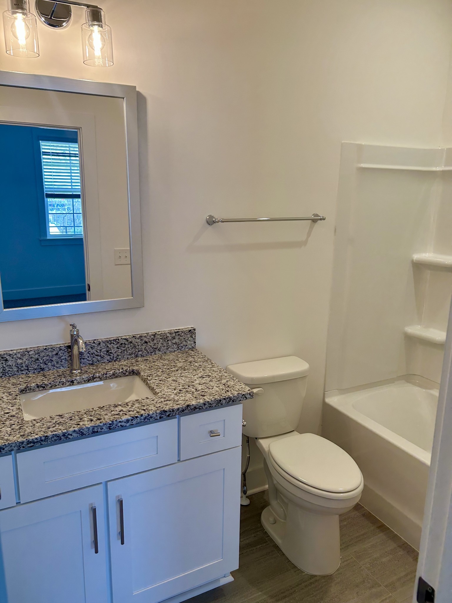 326 B Mulberry Terrace Madison, TN 37115 - Photo 13 of 21 a bathroom with a granite countertop toilet sink and mirror
