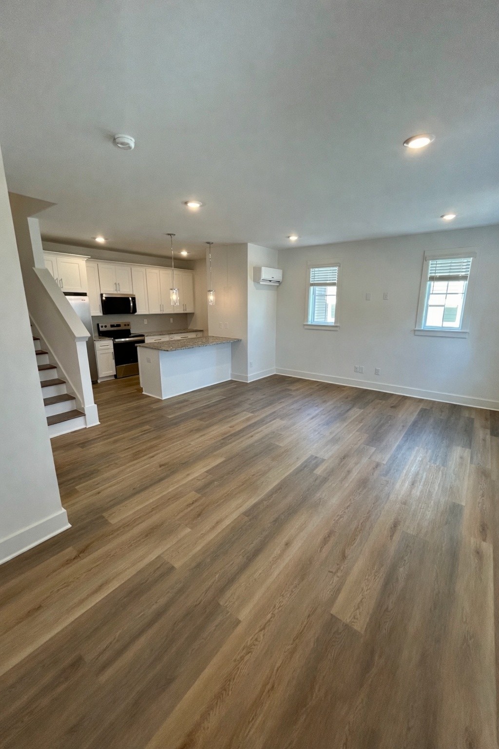 326 B Mulberry Terrace Madison, TN 37115 - Photo 5 of 21 an empty room with wooden floor and windows