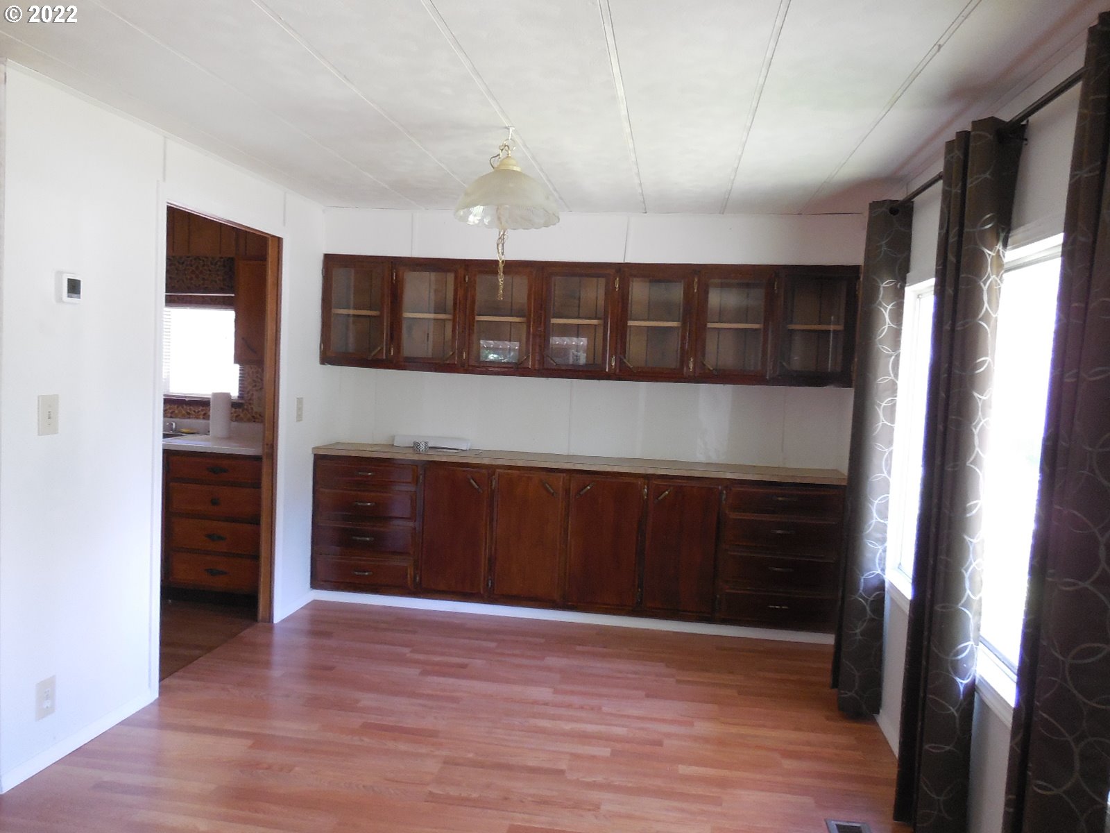 53785 West Crockett Road Milton Freewater, OR 97862 - Photo 6 of 14 a view of an empty room with wooden floor and a window