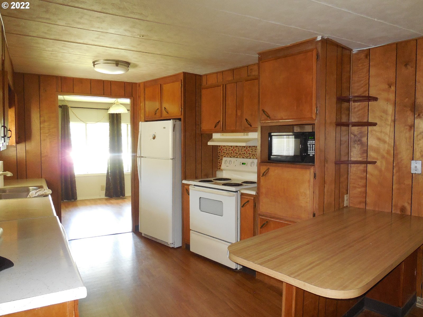 53785 West Crockett Road Milton Freewater, OR 97862 - Photo 8 of 14 a kitchen with stainless steel appliances a refrigerator and a stove