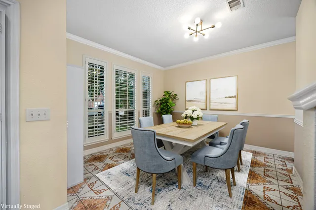 a view of a dining room with furniture window and outside view