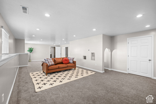 1045 West 3600th South Perry, UT 84302 - Photo 30 of 57 Recessed lighting, wall-to-wall carpeting, arched wall niches, and a paneled interior door