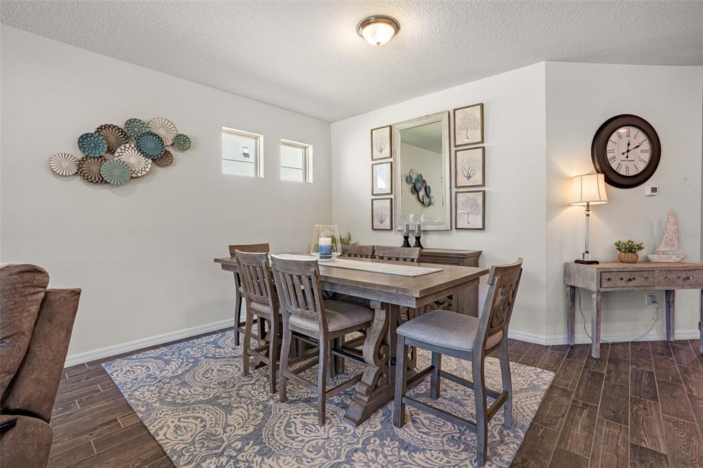 2825 Murray Pass Odessa, FL 33556 - Photo 14 of 43 a view of a dining room with furniture and wooden floor