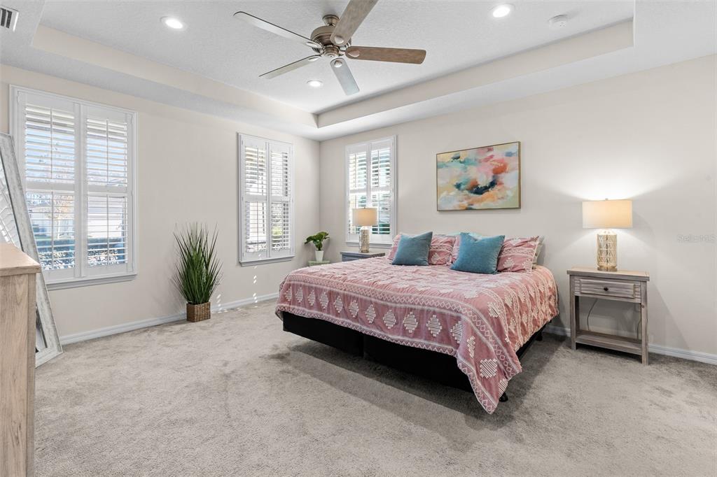 2825 Murray Pass Odessa, FL 33556 - Photo 17 of 43 a spacious bedroom with a bed and a large window