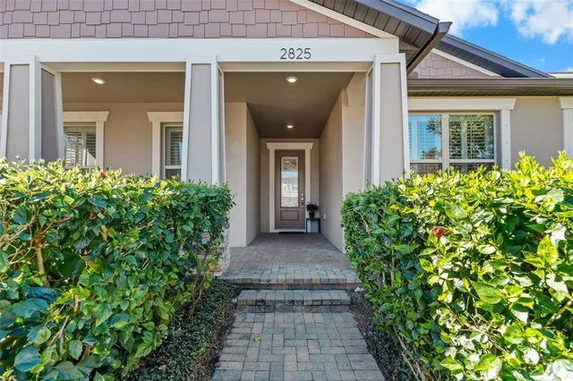 front view of the house with potted plants