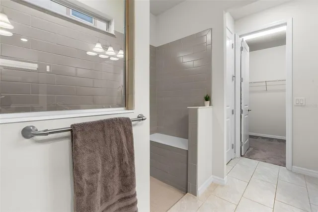 a bathroom with a shower and a sink