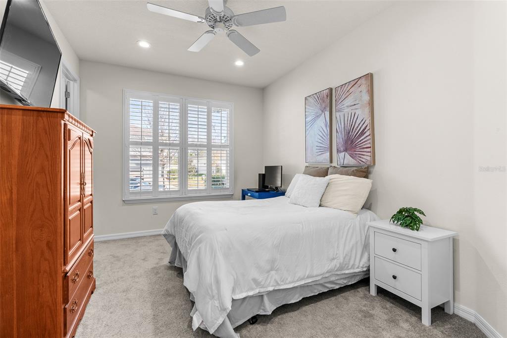 2825 Murray Pass Odessa, FL 33556 - Photo 25 of 43 a bedroom with a bed dresser and a window