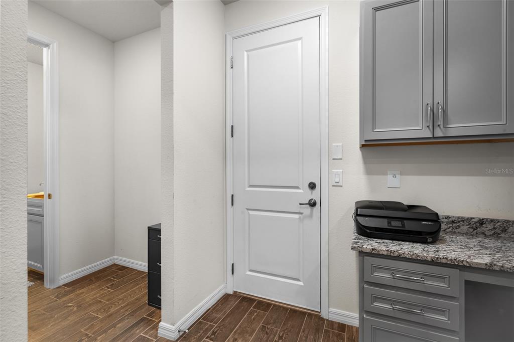 2825 Murray Pass Odessa, FL 33556 - Photo 28 of 43 a view of a kitchen from the hallway