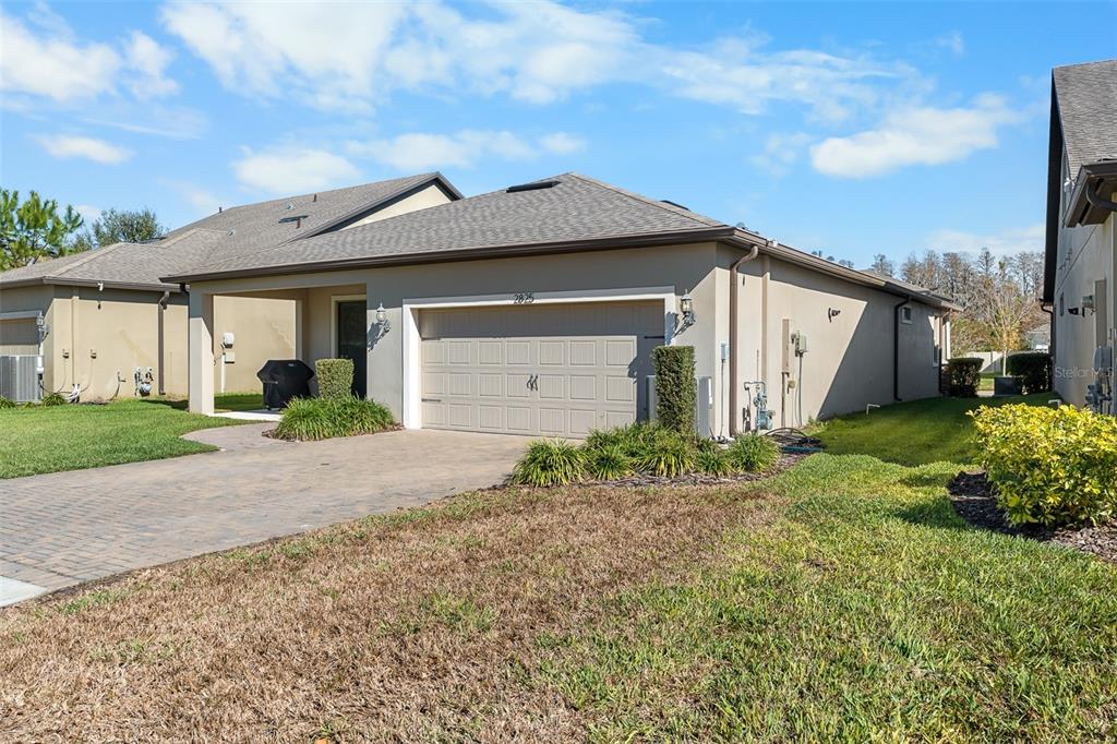 2825 Murray Pass Odessa, FL 33556 - Photo 34 of 43 a view of a house with a yard and garage