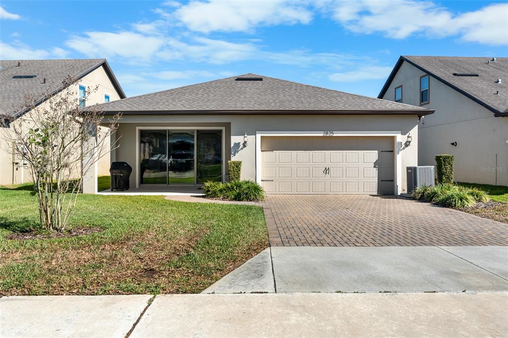 2825 Murray Pass Odessa, FL 33556 - Photo 35 of 43 front view of a house with a yard