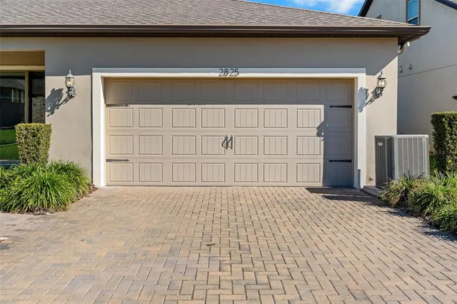 a view of a house with a wooden bench