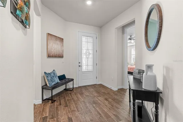 a view of a livingroom with furniture and wooden floor