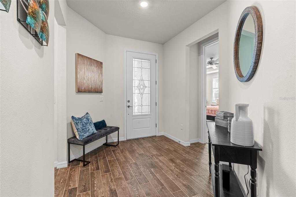 2825 Murray Pass Odessa, FL 33556 - Photo 4 of 43 a view of a livingroom with furniture and wooden floor