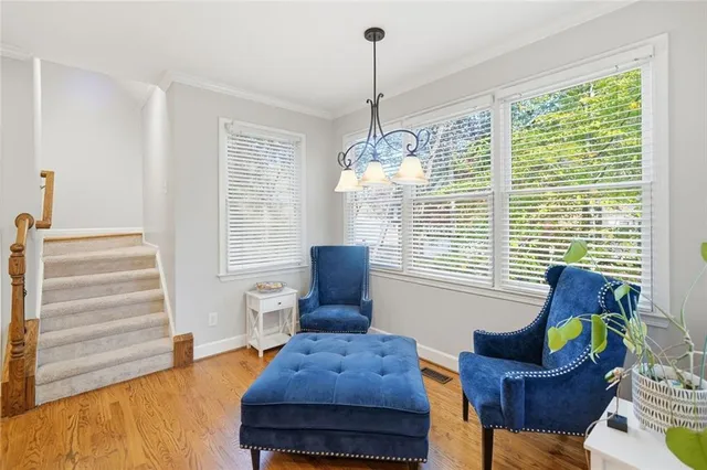 a kitchen with stainless steel appliances granite countertop a refrigerator a stove and a wooden floors