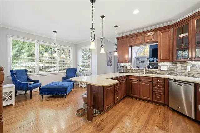 a bathroom with a sink a light fixture and a mirror